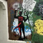 Banksy Hates Me Lower Haight Devil WWJD